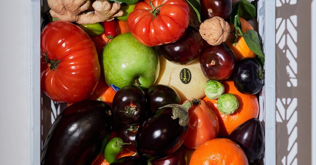 A basket full of colourful fresh fruits and vegetables