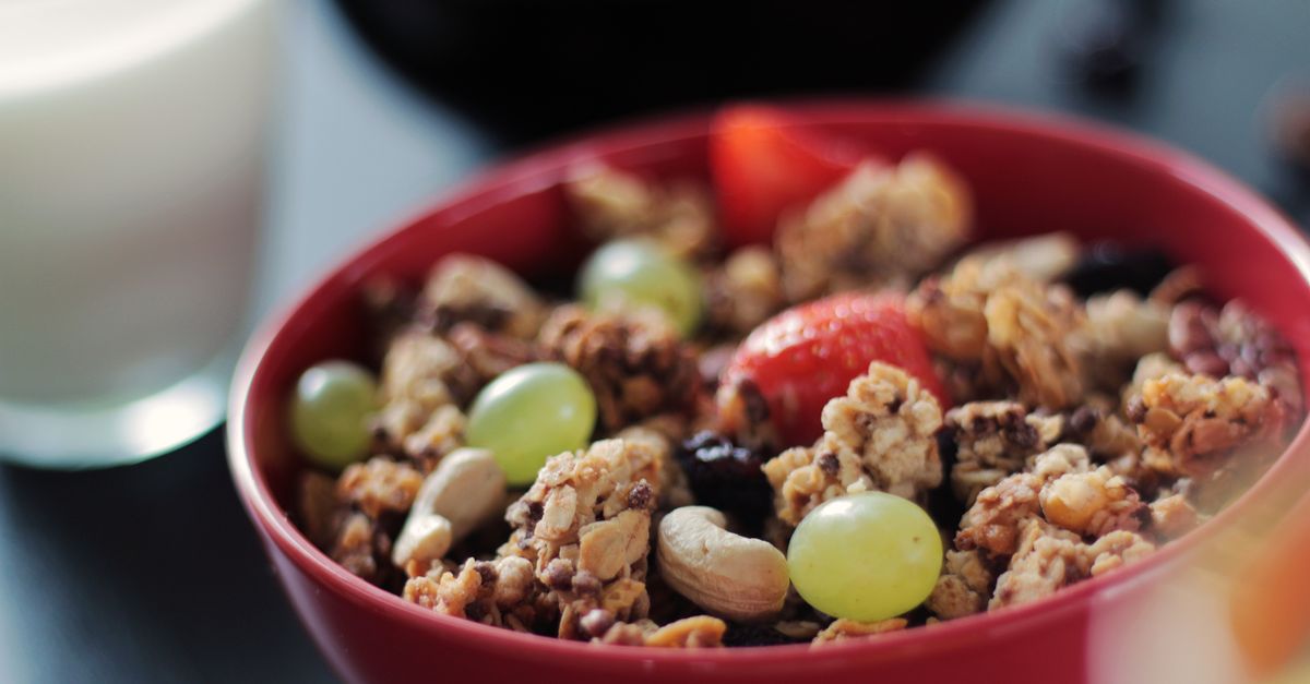 A bowl of muesli with fresh fruit, nuts and wholegrains