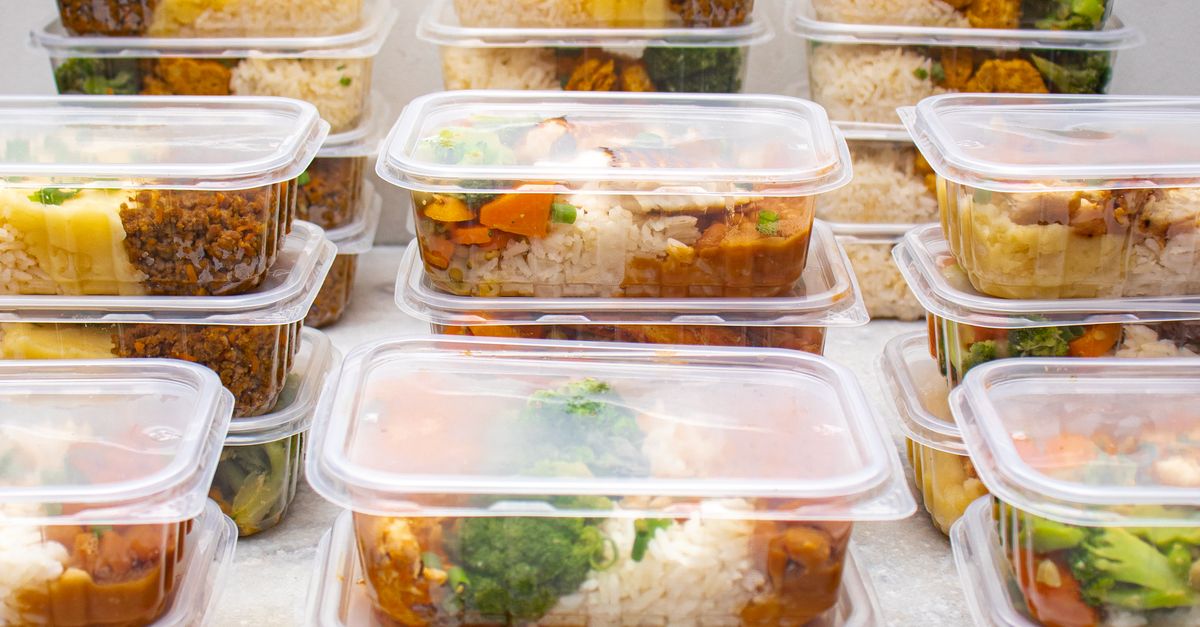 Organised meal prep containers filled with rice and vegetables