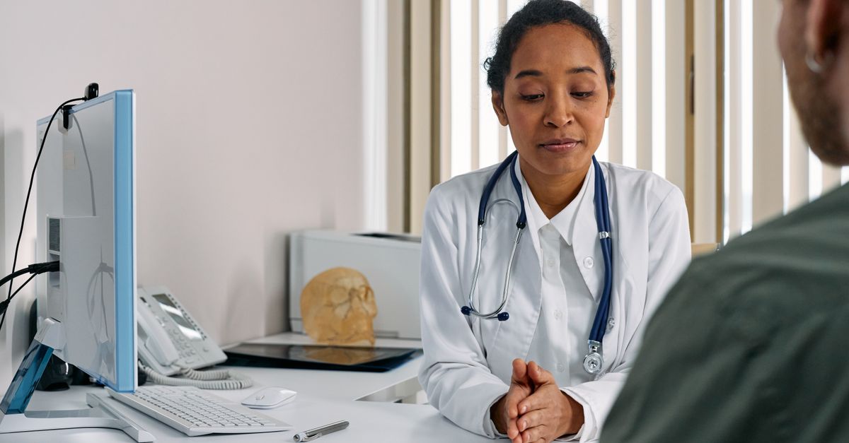 A doctor consulting with a patient in a medical office setting